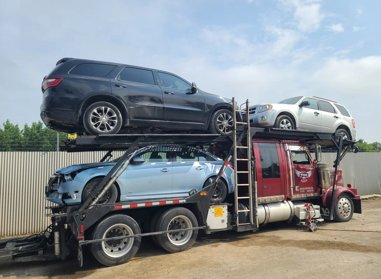 Company car carrier transporting multiple vehicles